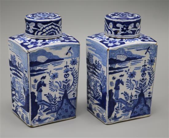 A pair of Dutch delft blue and white lidded tea caddies